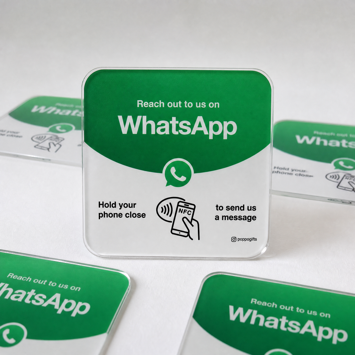 WhatsApp NFC card with green messaging design, shown with other cards